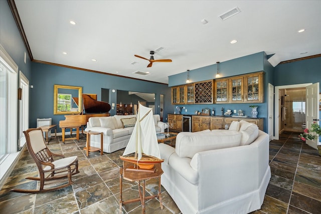 3814 Todville Rd, Seabrook, TX 77586 - living room featuring crown molding, recessed lighting, wet bar, a ceiling fan, and dark stone finish floors