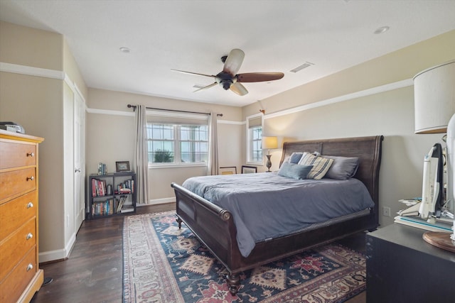 3814 Todville Rd, Seabrook, TX 77586 - bedroom featuring dark wood-style floors, baseboards, and a ceiling fan