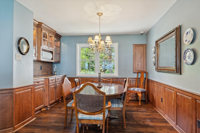 3814 Todville Rd, Seabrook, TX 77586 - dining room with a chandelier, dark wood-type flooring, and wainscoting