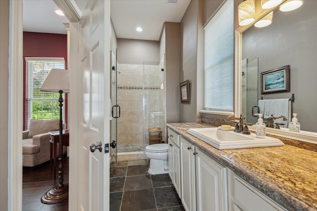 3814 Todville Rd, Seabrook, TX 77586 - bathroom with vanity, toilet, and a shower stall
