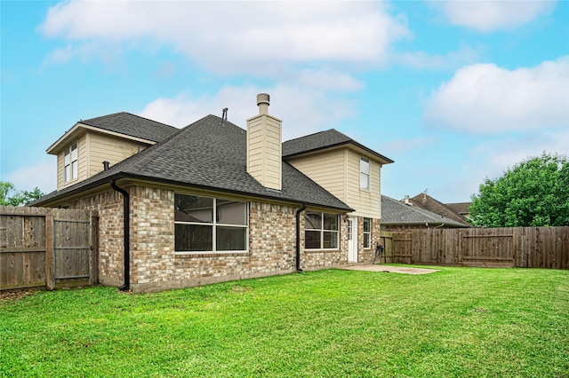 rear view of house featuring brick siding, roof with shingles, a patio area, and a chimney