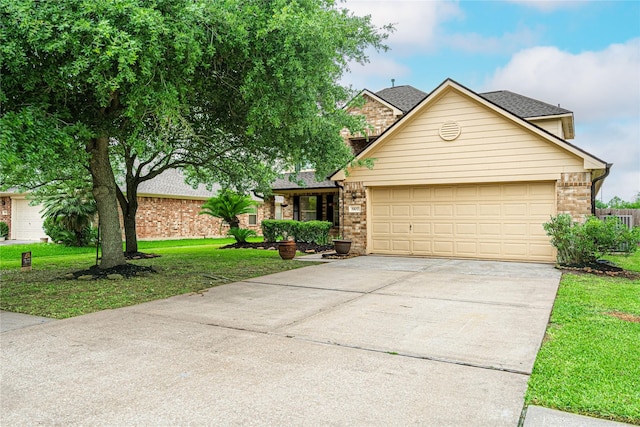 traditional-style house featuring concrete driveway, a garage, brick siding, a front lawn, and a shingled roof
