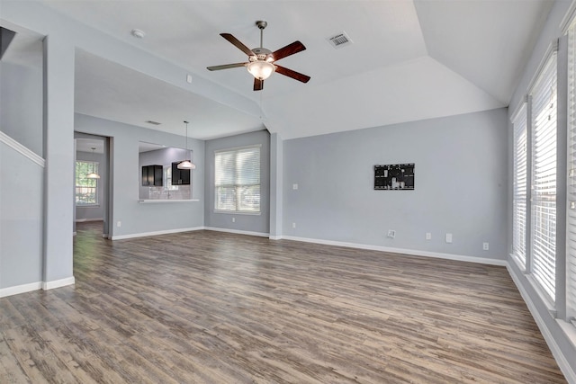 3807 Springcrest Ln, Montgomery, TX 77356 - unfurnished living room with a ceiling fan, wood finished floors, vaulted ceiling, and baseboards