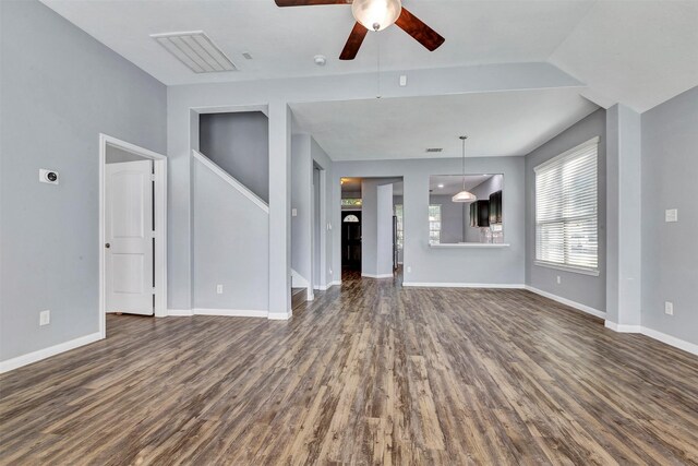 3807 Springcrest Ln, Montgomery, TX 77356 - unfurnished living room featuring dark wood-type flooring, ceiling fan, and baseboards