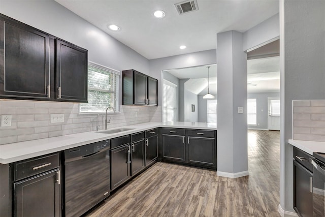 3807 Springcrest Ln, Montgomery, TX 77356 - kitchen with a sink, black dishwasher, light wood finished floors, light countertops, and recessed lighting