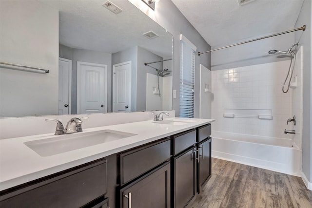 3807 Springcrest Ln, Montgomery, TX 77356 - bathroom with shower / washtub combination, wood finished floors, and double vanity