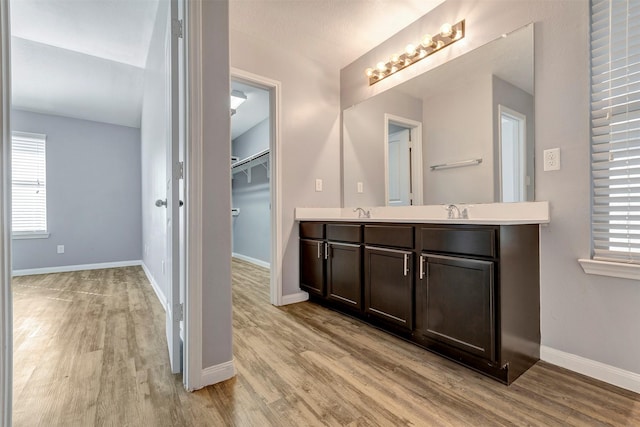 3807 Springcrest Ln, Montgomery, TX 77356 - bathroom with wood finished floors, healthy amount of natural light, and double vanity