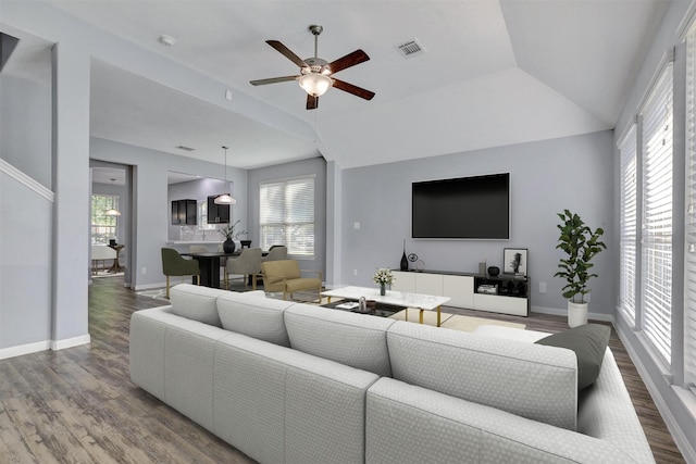3807 Springcrest Ln, Montgomery, TX 77356 - living room with wood finished floors, ceiling fan, baseboards, and lofted ceiling