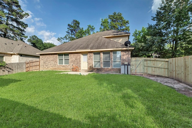 3807 Springcrest Ln, Montgomery, TX 77356 - back of property with brick siding, a gate, a patio area, and roof with shingles