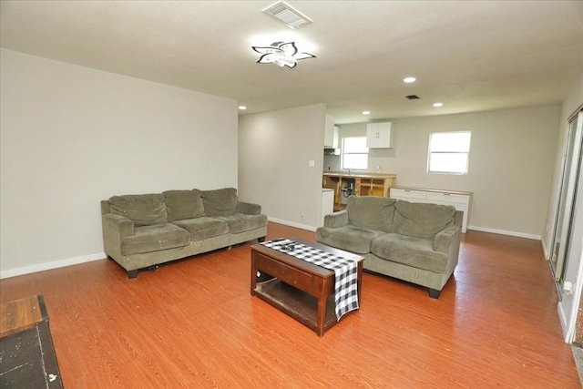 26643 Carol Ln, Splendora, TX 77372 - living room with light wood-style flooring, baseboards, and recessed lighting