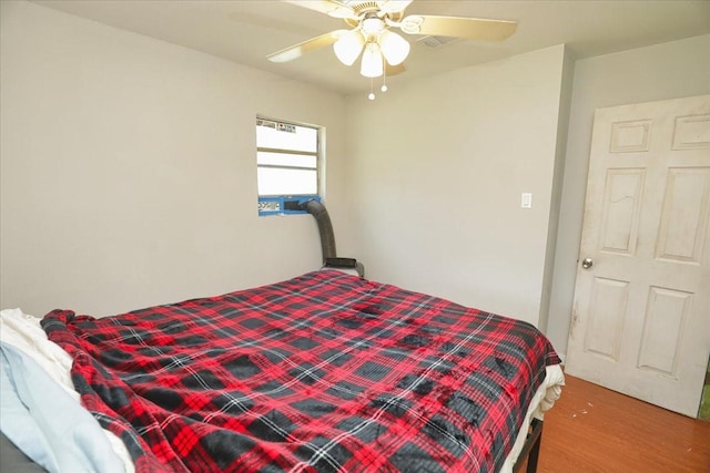 26643 Carol Ln, Splendora, TX 77372 - bedroom featuring wood finished floors and a ceiling fan