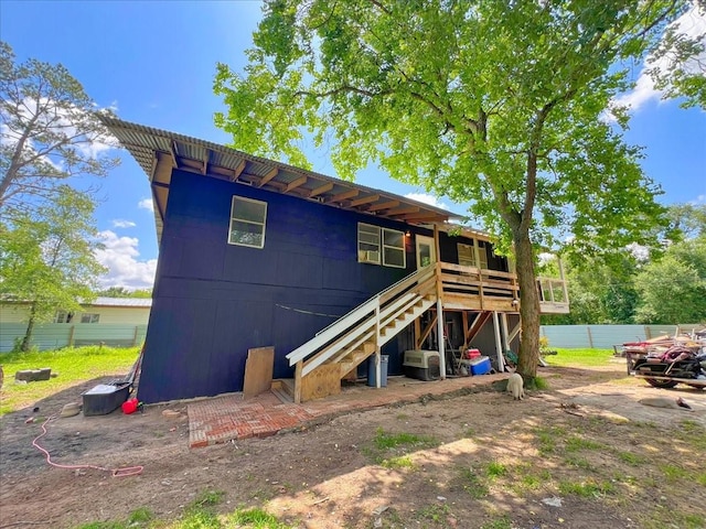 26643 Carol Ln, Splendora, TX 77372 - rear view of property with fence, stairs, and a wooden deck
