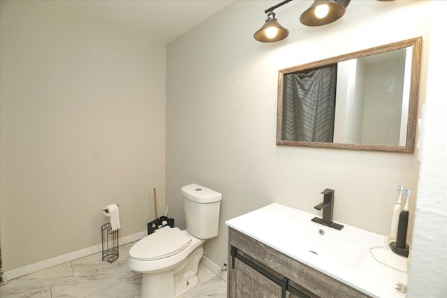 26643 Carol Ln, Splendora, TX 77372 - bathroom featuring marble finish floors, toilet, vanity, and baseboards