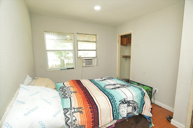 26643 Carol Ln, Splendora, TX 77372 - bedroom featuring wood finished floors, cooling unit, baseboards, and recessed lighting