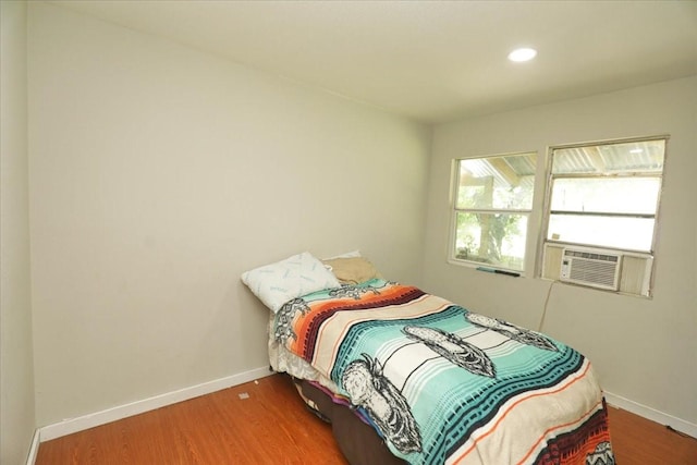 26643 Carol Ln, Splendora, TX 77372 - bedroom with cooling unit, wood finished floors, baseboards, and recessed lighting