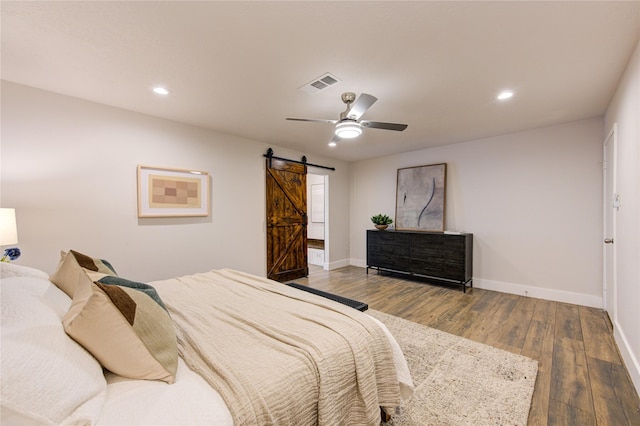 11611 Highgrove Dr, Houston, TX 77077 - bedroom featuring a barn door, baseboards, wood finished floors, a ceiling fan, and recessed lighting