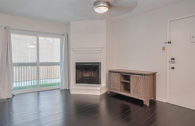 1900 Bay Area Blvd Unit 184, Houston, TX 77058 - unfurnished living room with ceiling fan, a brick fireplace, plenty of natural light, and dark wood-style floors