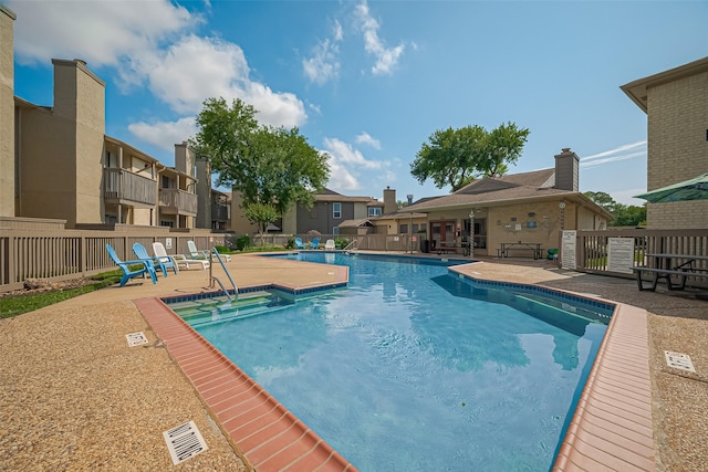 1900 Bay Area Blvd Unit 184, Houston, TX 77058 - community pool featuring a patio area, fence, and a residential view