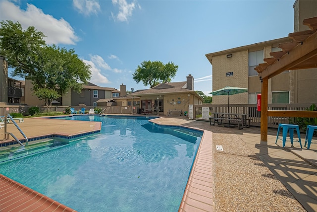 1900 Bay Area Blvd Unit 184, Houston, TX 77058 - community pool featuring a patio and fence