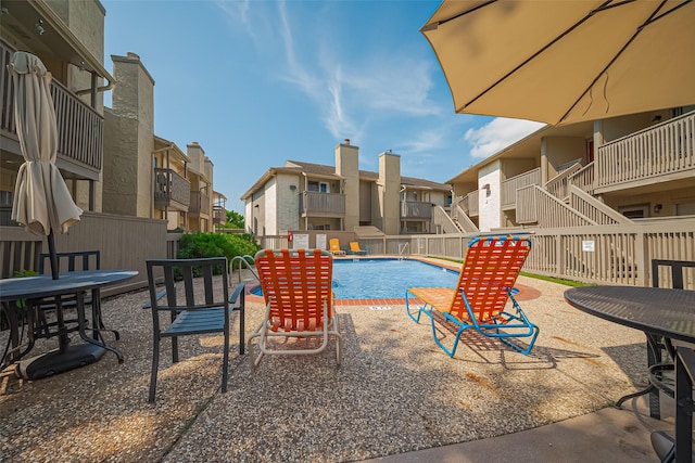 1900 Bay Area Blvd Unit 184, Houston, TX 77058 - community pool featuring a residential view, fence, and a patio area