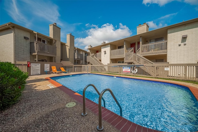 1900 Bay Area Blvd Unit 184, Houston, TX 77058 - community pool featuring fence and a residential view