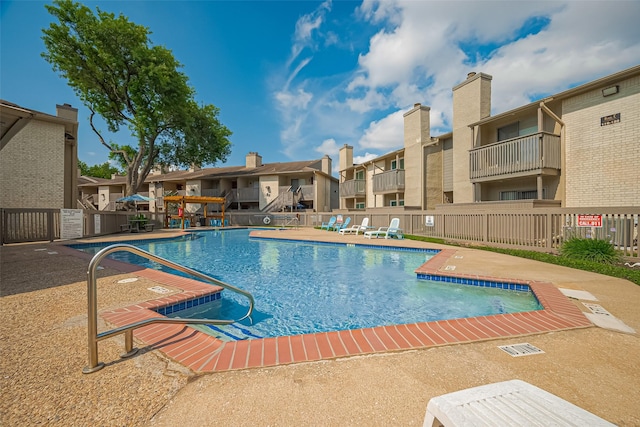 1900 Bay Area Blvd Unit 184, Houston, TX 77058 - community pool featuring a residential view, fence, and a patio