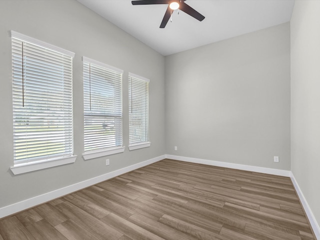 1462 Rd 66114, Dayton, TX 77535 - unfurnished room with a ceiling fan, wood finished floors, and baseboards