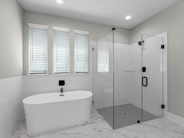 1462 Rd 66114, Dayton, TX 77535 - full bath featuring marble finish floors, a soaking tub, a shower stall, healthy amount of natural light, and recessed lighting