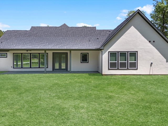 1462 Rd 66114, Dayton, TX 77535 - rear view of property featuring french doors, a yard, a shingled roof, and stucco siding