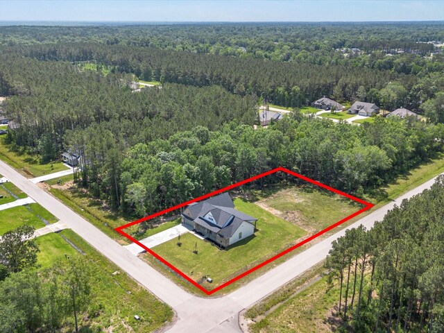 1462 Rd 66114, Dayton, TX 77535 - aerial view of property and surrounding area featuring a forest and property boundaries highlighted