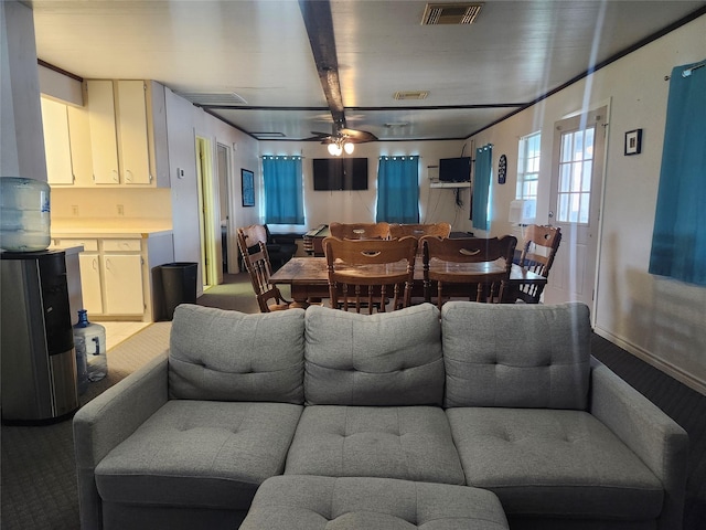 living area with carpet floors and a ceiling fan