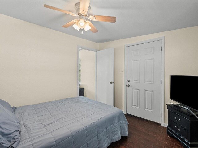 1134 Canal Dr, Surfside Beach, TX 77541 - bedroom featuring dark wood-style floors and ceiling fan
