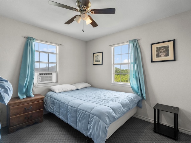 1134 Canal Dr, Surfside Beach, TX 77541 - bedroom with multiple windows, carpet, and ceiling fan