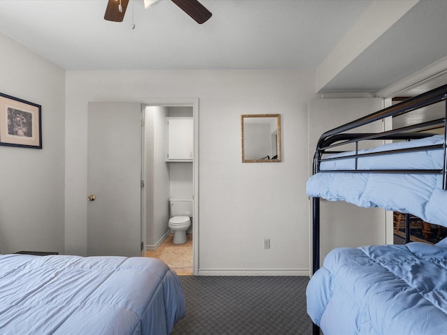 1134 Canal Dr, Surfside Beach, TX 77541 - bedroom featuring carpet floors, connected bathroom, and ceiling fan