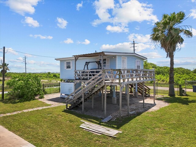 1134 Canal Dr, Surfside Beach, TX 77541 - rear view of property with stairs, a deck, and a carport
