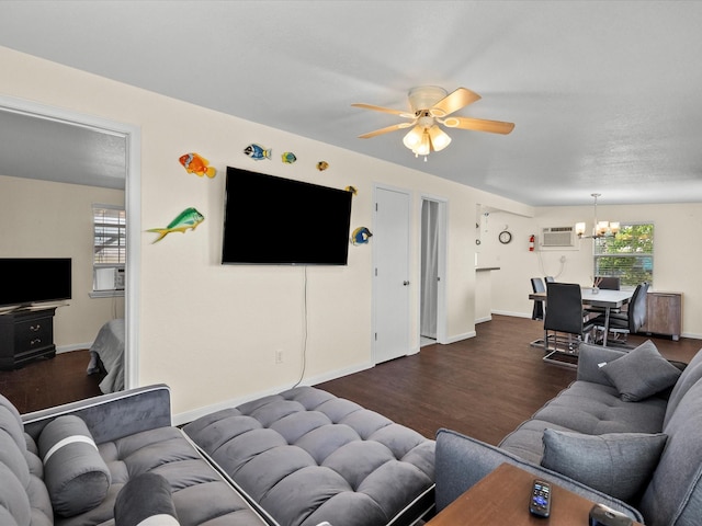1134 Canal Dr, Surfside Beach, TX 77541 - living room with a chandelier, dark wood-style floors, a ceiling fan, and a wall mounted air conditioner