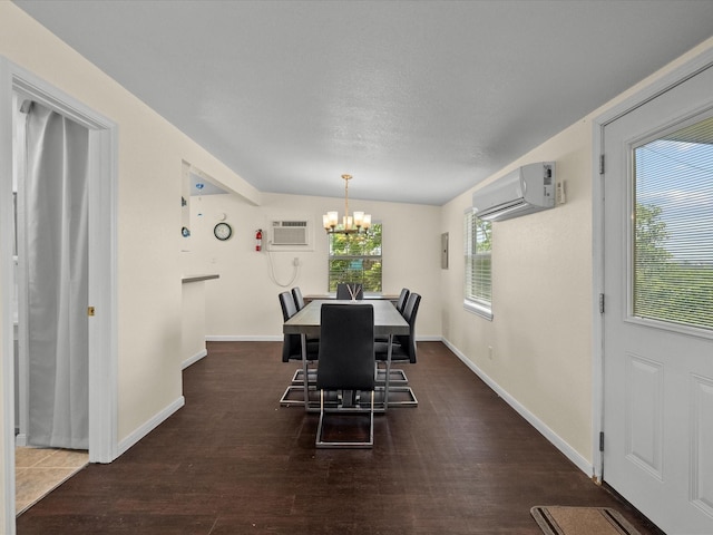 1134 Canal Dr, Surfside Beach, TX 77541 - dining space featuring a wall mounted air conditioner, a wall mounted AC, a chandelier, and dark wood-style flooring