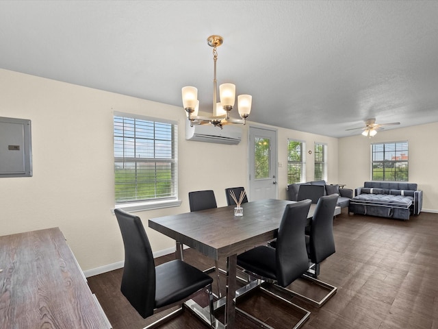 1134 Canal Dr, Surfside Beach, TX 77541 - dining room featuring electric panel, a wall unit AC, a chandelier, and ceiling fan