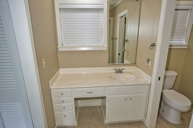 524 Oak Dr, Lake Jackson, TX 77566 - bathroom featuring toilet, vanity, and tile patterned flooring