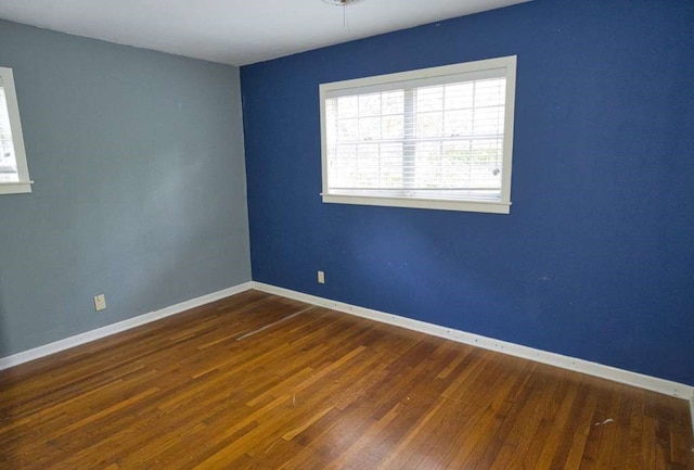 524 Oak Dr, Lake Jackson, TX 77566 - unfurnished room with hardwood / wood-style floors and baseboards