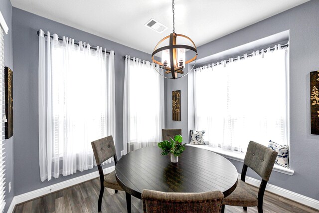 4302 Stoney Heights Ct, Spring, TX 77388 - dining room featuring a chandelier, baseboards, and dark wood-style flooring