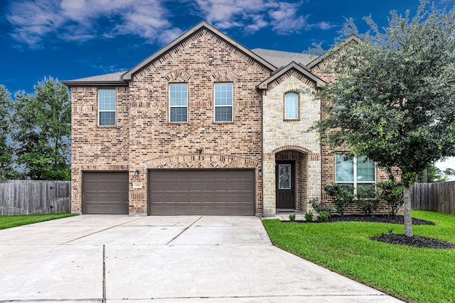 4302 Stoney Heights Ct, Spring, TX 77388 - view of front of home with an attached garage, concrete driveway, brick siding, and stone siding