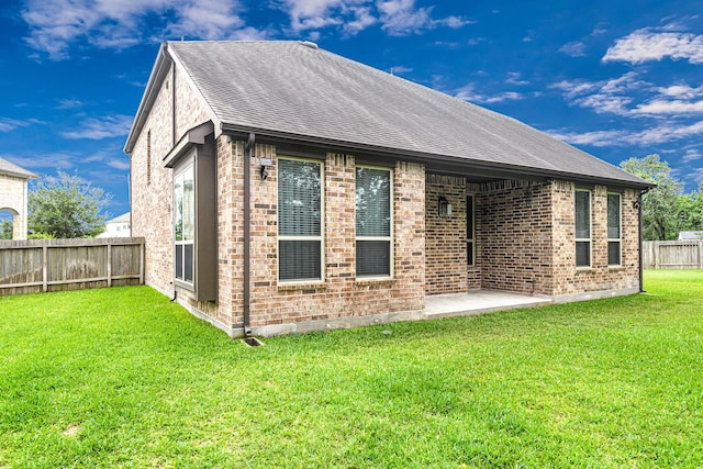 4302 Stoney Heights Ct, Spring, TX 77388 - rear view of property with brick siding, roof with shingles, and a patio area