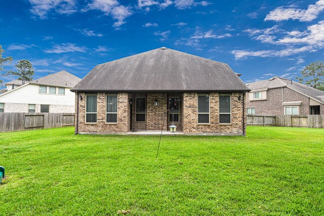 4302 Stoney Heights Ct, Spring, TX 77388 - back of house featuring brick siding, a patio, and a shingled roof
