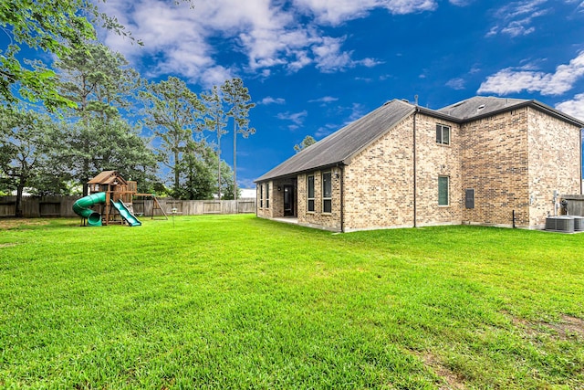 4302 Stoney Heights Ct, Spring, TX 77388 - rear view of property featuring a playground, brick siding, and cooling unit