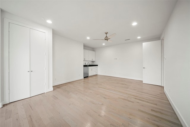 unfurnished living room featuring ceiling fan, recessed lighting, light wood-type flooring, and baseboards