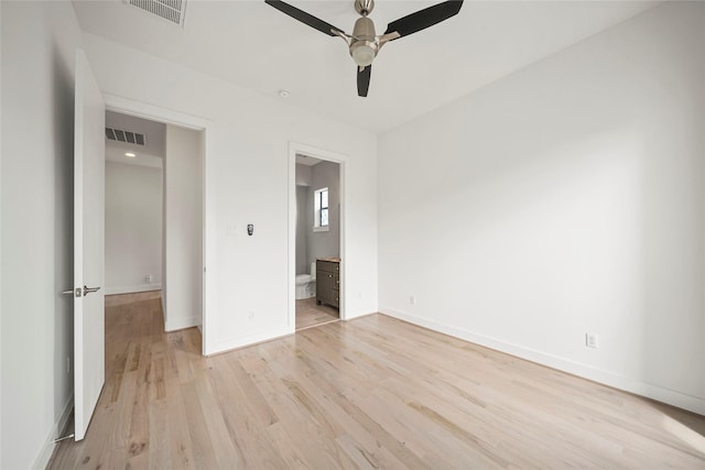 unfurnished bedroom with light wood-type flooring, baseboards, connected bathroom, and ceiling fan