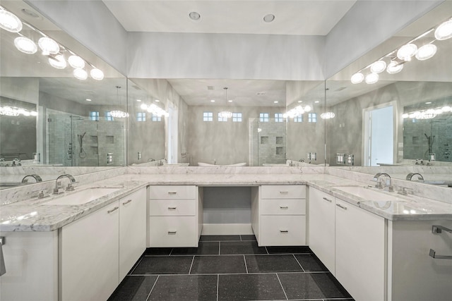 bathroom with two vanities and healthy amount of natural light