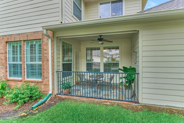71 Ginger Jar St, The Woodlands, TX 77382 - doorway to property with a ceiling fan, brick siding, and a patio area