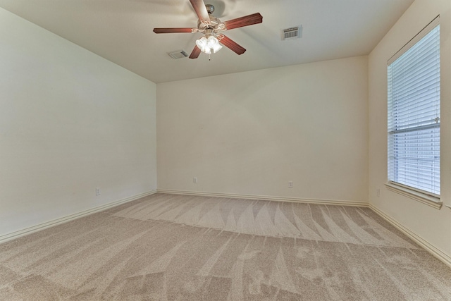 71 Ginger Jar St, The Woodlands, TX 77382 - empty room featuring light carpet, a ceiling fan, and baseboards